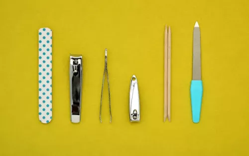 Neatly arranged nail clippers, emory boards, and other nail tools.