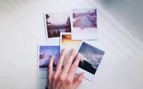 A handful of polaroids with beautiful views of beaches, sunsets, etc.