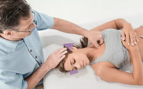 Til Luchau works with a client using an SCM Attachment Technique helps the client learn to relax the SCM.