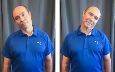 A man in a blue shirt tilts his head laterally left to right, testing range of motion.