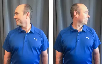 A man in a blue shirt turns his head in lateral flexion left to right, testing range of motion.