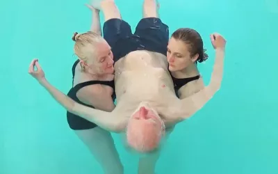 The author Harold Dull, his daughter Calias, and a friend doing three-way tandem watsu.