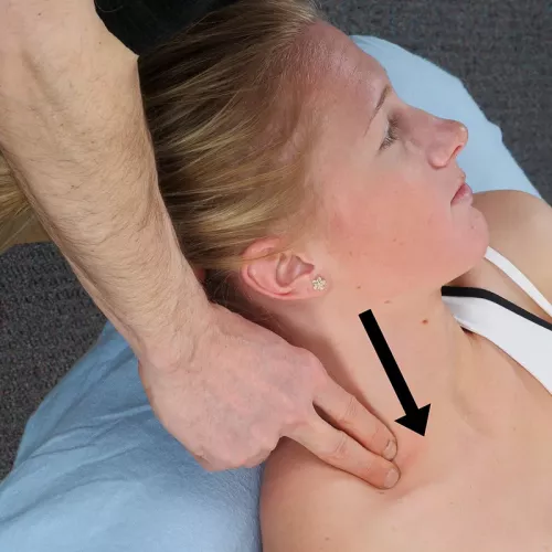 A therapist uses two fingers to apply light pressure near the scalene muscles.
