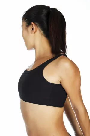 I woman stretching her shoulders back and arms down.