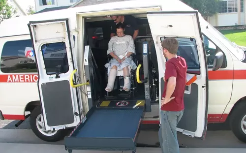 The author being wheeled out of an accessible van shortly after her accident.