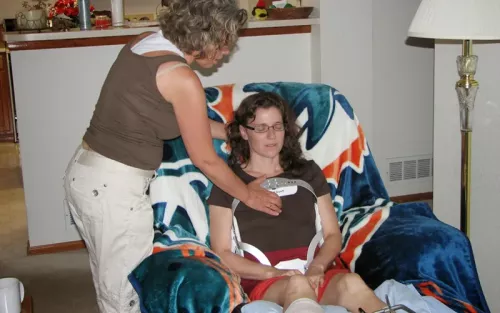 the author sitting in an armchair in a brace, recovering after a climbing accident.