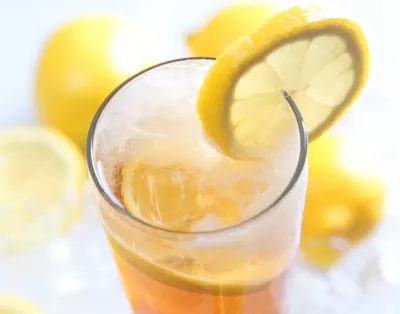 cup of sweet tea with lemon slice on the rim of the glass.