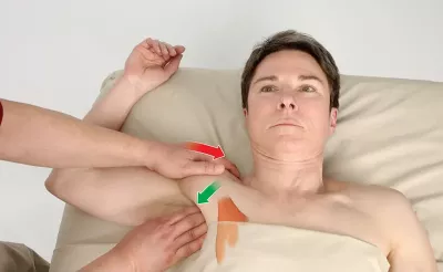 An MT abducting a client's shoulder.