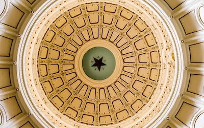 gold domed ceiling in a government courthouse.