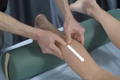 an MT stripping with active engagement on a client's lower calf muscle.