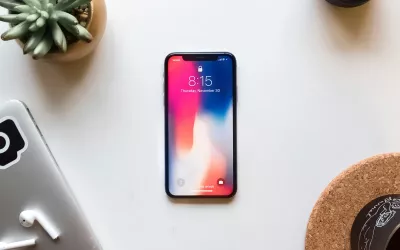 A mobile phone rests on a table.